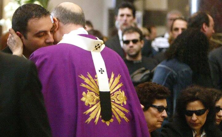 ai funerali il cardinal bertone abbraccia il fratello di quattrocchi