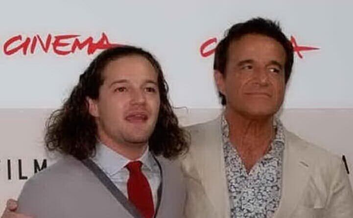 con il figlio brando (foto ansa e instagram)